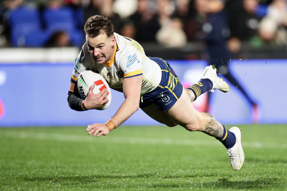 Eels fullback Clint Gutherson scores against the Warriors on Friday.