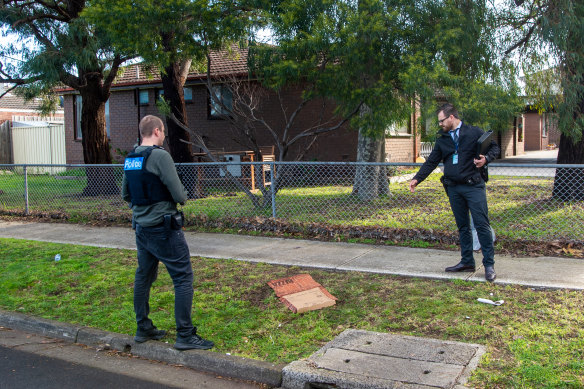 Police inspect the scene where a pizza delivery driver was slashed in Glenroy.