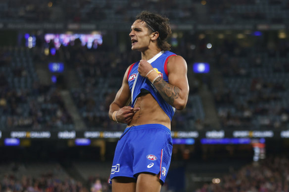 Jamarra Ugle-Hagan of the Western Bulldogs last month made a similar gesture, inspired by Winmar, after he was subjected to racist abuse online.