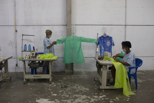 Instead of Carnival costumes, workers from the Vila Isabel samba school make scrubs for medical workers in Rio de Janeiro in April.