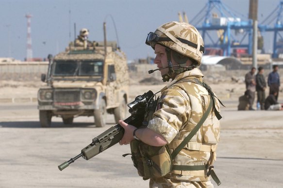 British troops secure the scene of a roadside bomb attack on a British patrol in 2006.