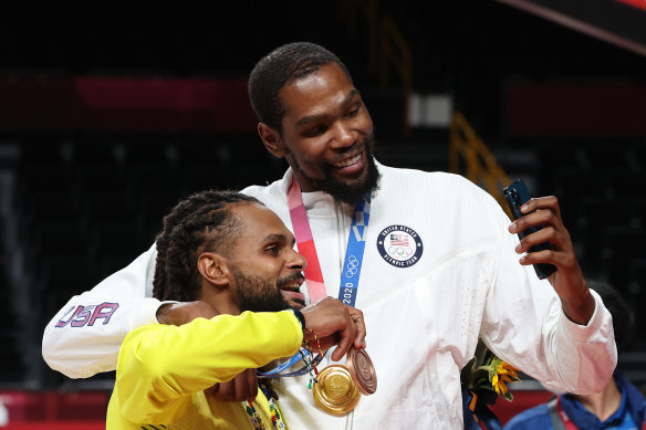 New Brooklyn teammates Patty Mills and Kevin Durant at the Tokyo Olympics.