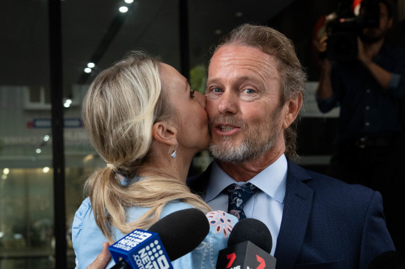 Craig McLachlan is kissed by his partner, Vanessa Scammell, after a not guilty verdict in his sexual assault trial. 