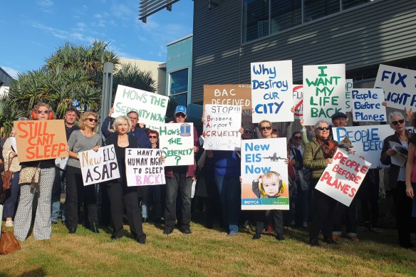 Brisbane residents protest aircraft noise outside the Brisbane Airport Corporation headquarters.