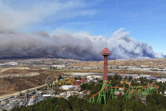 The tower at Six Flags Magic Mountain with the Hughes Fire burning in Castaic, California.