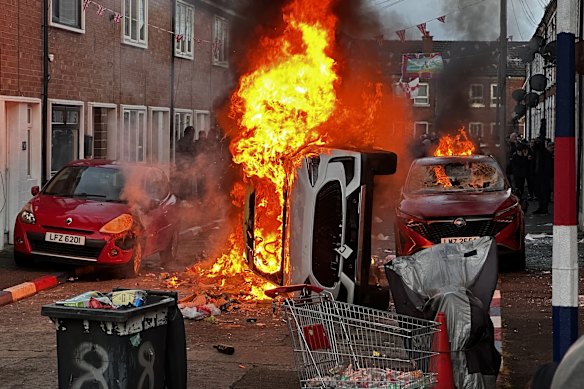 Vehicles were set on fire in Lendrick Street on the first night of disorder.