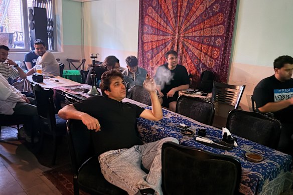 Iran supporters watch the game from a cafe in Tehran.