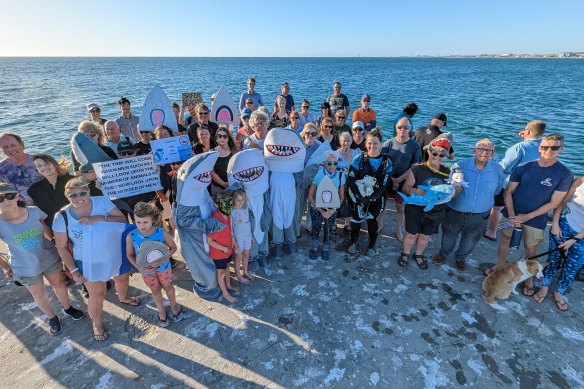 A “community photoshoot” held Thursday night to promote responsible fishing at Ammunition Jetty, Coogee. 