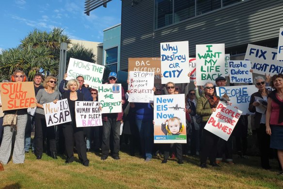 Brisbane residents protest aircraft noise outside the Brisbane Airport Corporation headquarters.