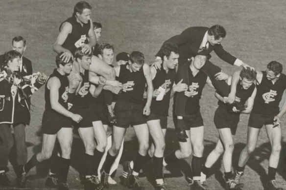 Jubilant Carlton players chair their elated coach, Ron Barassi, and captain John Nicholls after winning the 1968 grand final.