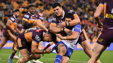 Crunch time: Canterbury's Dallin Watene-Zelezniak fails to crack the Broncos' defence.