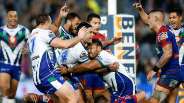 Out of jail: Sam Lisone celebrates scoring the winning try for the Warriors at McDonald Jones Stadium.