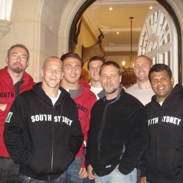 Feather (rear, at right) and Sam Burgess (centre, in red) meeting Russell Crowe (front centre) in 2006.