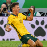 Australia’s Ajdin Hrustic scores the winner against the UAE, setting up a play-off against Peru.