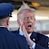 President Donald Trump yells as he arrives on Air Force One.