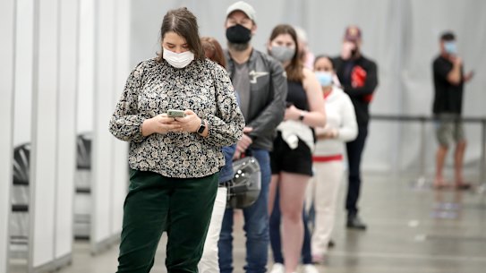People line up at the newly-opened vaccination hub at Brisbane Convention & Exhibition Centre. 