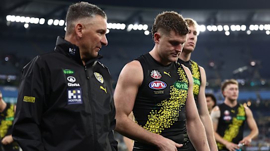 Adem Yze and Jacob Hopper leave the ground at the MCG on Friday night.