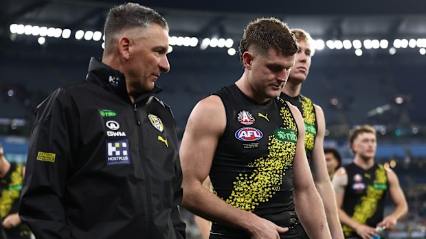 Adem Yze and Jacob Hopper leave the ground at the MCG on Friday night.