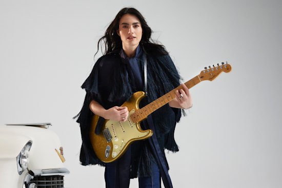 Zimmermann “Celestial Fringe” cape and “Kaleidoscope” jeans.