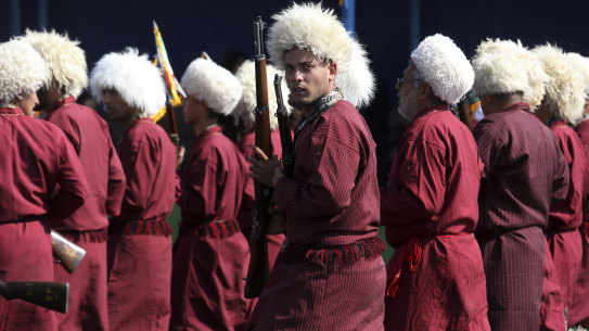Wearing their traditional garments, a group of Iranian Turkmen, members of Basij paramilitary force, affiliated to the Revolutionary Guard, march last year. The Basij Cooperative Foundation, linked to the Basij militia was also sanctioned.