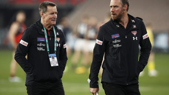 Bombers coach John Worsfold (left) with his successor Ben Rutten.