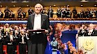 Richard Robson celebrates with his prize during the Nobel Prize ceremony.