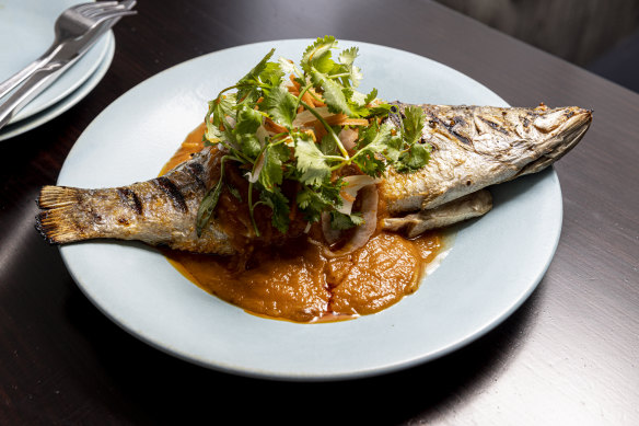 Whole fish with tomato nuoc mam, dill, lime, chilli, and spring onion.