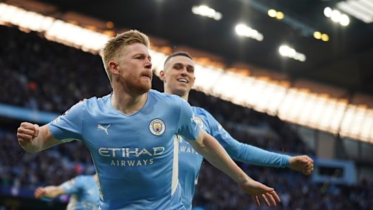 Kevin De Bruyne, front, celebrates with Phil Foden after opening the scoring for City inside two minutes.