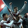 Zeki Celik, Arda Guler and Mert Muelduer celebrate Turkey’s qualification for the World Cup.