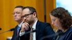 Housing Australia CEO Scott Langford, centre with Housing Australia chair Damien Tangey, left and Treasury first assistant secretary Nerida Hunter in Senate Estimates on Thursday. 
