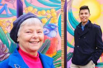 Photo of local resident, Laura Brinson with Yarra Energy Foundation, Tim Shue posing next to a battery that has been  painted by artist Hayden Dewar in Fitzroy North on Thursday 23 June 2022. Photo Luis Enrique Ascui