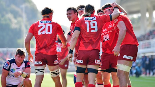 The Sunwolves celebrate a try against the Melbourne Rebels in 2020.