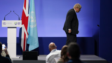 British Prime Minister Boris Johnson leaves the Glasgow climate summit on Wednesday. 