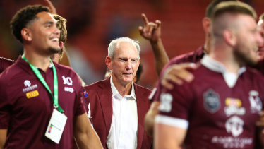 A contented Wayne Bennett looks on as the Maroons celebrate a famous victory.