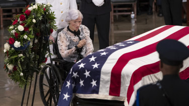 Roberta McCain stops at her son's flag-draped casket in the US Capitol rotunda.