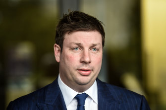 Opposition MP Tim Smith faces the media after crashing his car on Saturday night and recording an alcohol reading of more than twice the legal limit.