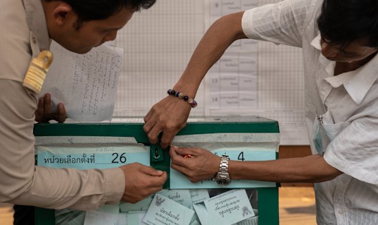 Officials open a sealed ballot box ahead of counting for a general election at a counting centre in Bangkok on Sunday. It was Thailand's first general election since the military seized power five years ago.