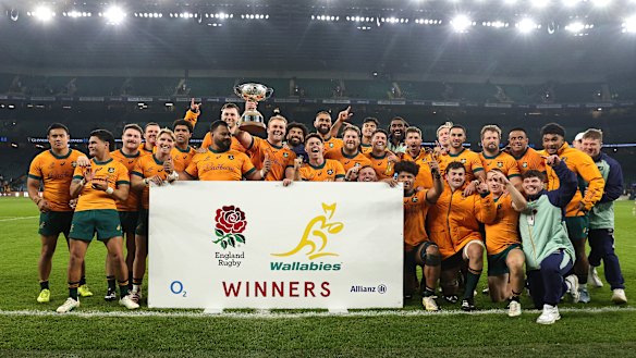 The Wallabies celebrate with the Ella Mobbs Cup after their victory.