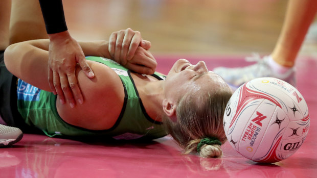 Down and out: Courtney Bruce feels the pain after a heavy fall in the opening round.