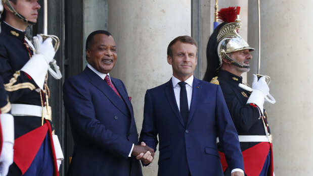 Republic of Congo President Denis Sassou Nguesso, left, is greeted by French President Emmanuel Macron before a meeting at the Elysee Palace in Paris on Tuesday.