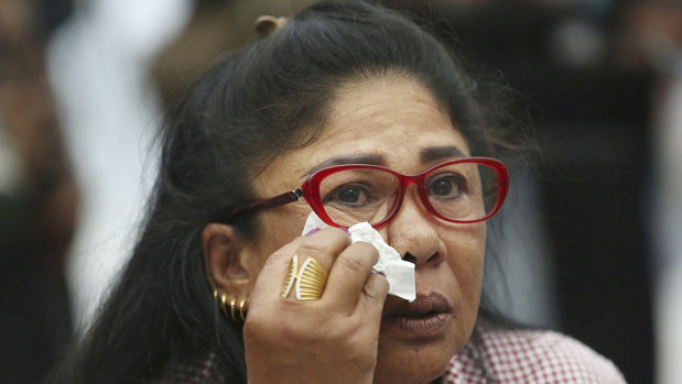 A supporter of the Thai Raksa Chart party cries at the Constitutional Court in Bangkok.