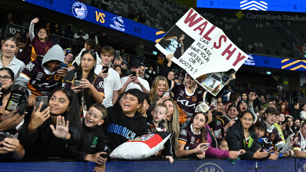 Hundreds of fans wait in the rain at CommBank Stadium for Reece Walsh and the Broncos on Friday night .