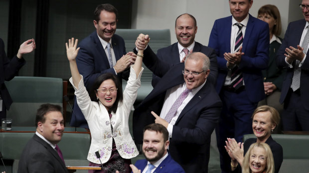 Liberal MP Gladys Liu is congratulated by Prime Minister Scott Morrison  after delivering her first speech in the House of Representatives in July 2019.
