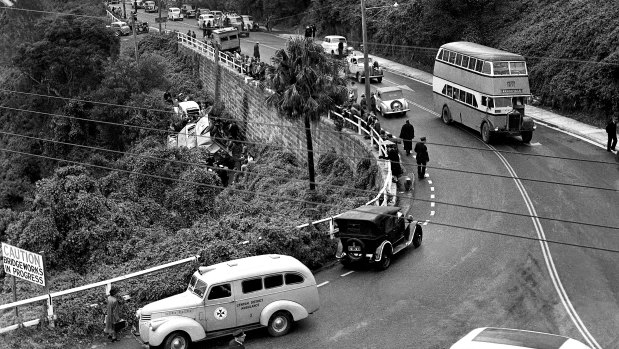 Scene of a bus crash on Manly Road, Seaforth, just before The Spit Bridge on 30 May, 1949, where the double decker bus to St Leonards crashed through the safety fence and dropped on to its side below. 