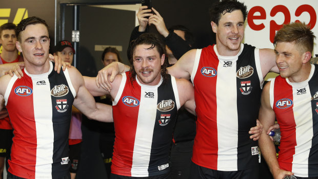 Songs of praise: Jack Steven (second left) with Saints teammates after their tight comeback win over the Dockers.