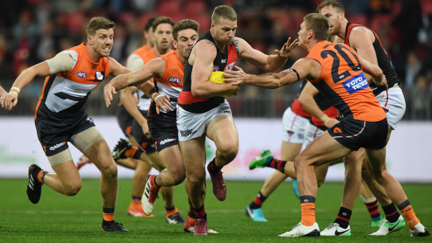 Stringer fights his way clear from several GWS opponents.