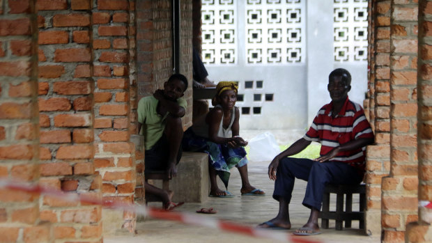 People suspected of having the Ebola virus wait at a treatment centre in Bikoro, Democratic Republic of Congo. 