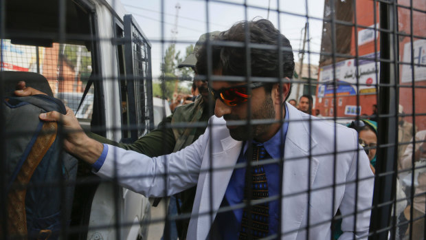 Indian police detain a Kashmiri doctor who staged a sit-in protest demanding restoration of landline and internet connectivity in hospitals in Srinagar, Indian controlled Kashmir, on Monday.