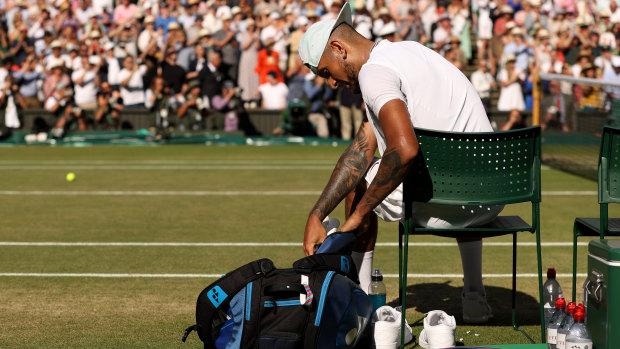 Nick Kyrgios packs his bags after the Wimbledon final