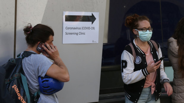 People line up outside the Royal Melbourne Hospital for coronavirus testing earlier this month.